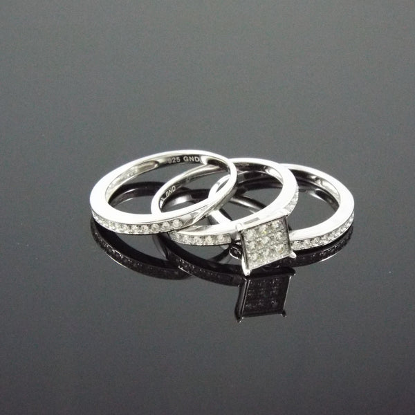 Triple Threat - Sterling silver set of three stacking bands with white pavé czs and center nine stone cubic zirconia solitaires